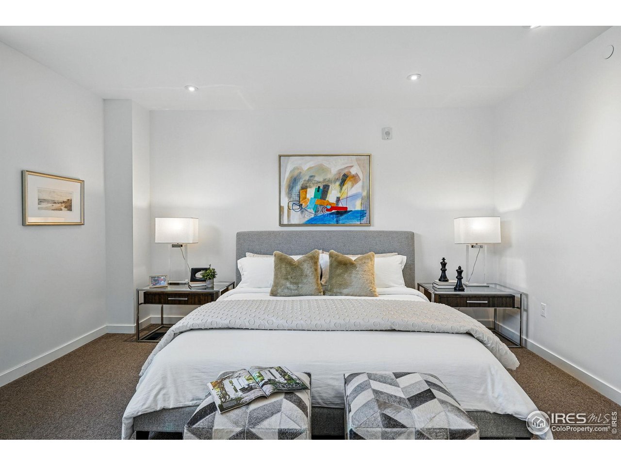 1916 23rd Street, Unit 6 Boulder, CO 80302 - Photo 17 of 27 a bedroom with a bed and a painting on the wall