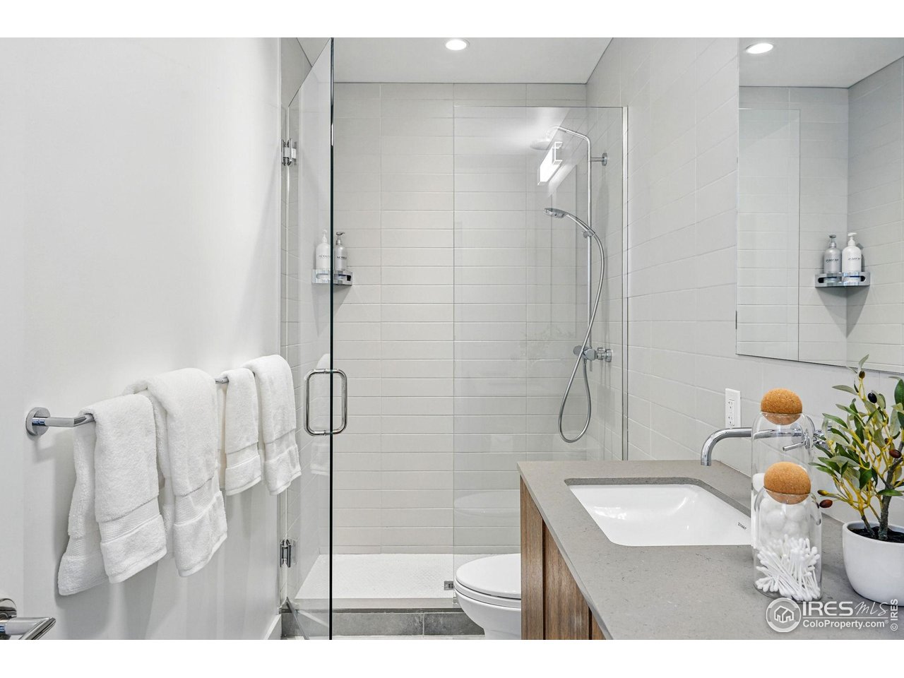 1916 23rd Street, Unit 6 Boulder, CO 80302 - Photo 18 of 27 a bathroom with a sink toilet and shower
