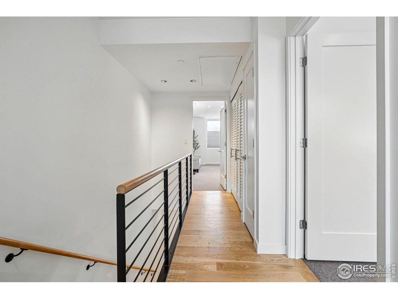 1916 23rd Street, Unit 6 Boulder, CO 80302 - Photo 23 of 27 a view of a hallway with wooden floor