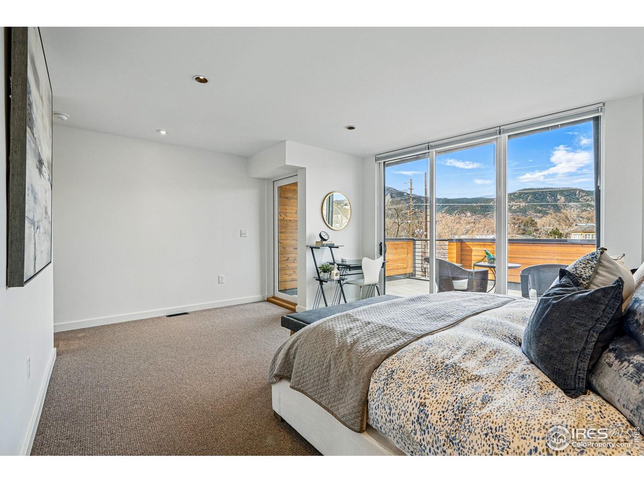 1916 23rd Street, Unit 6 Boulder, CO 80302 - Photo 9 of 27 a bed room with a bed and a large window