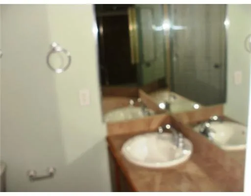 a close view of a utility room with washer and dryer