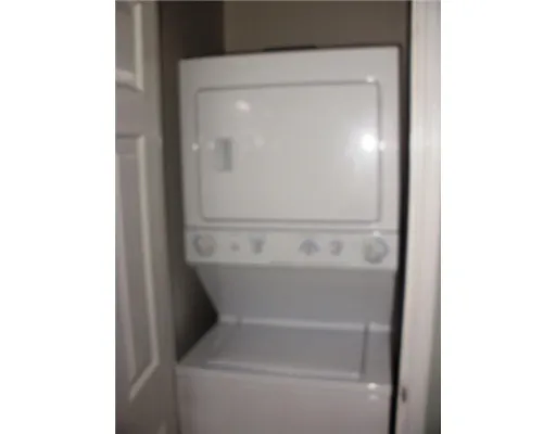 a view of a house with pool and sitting area