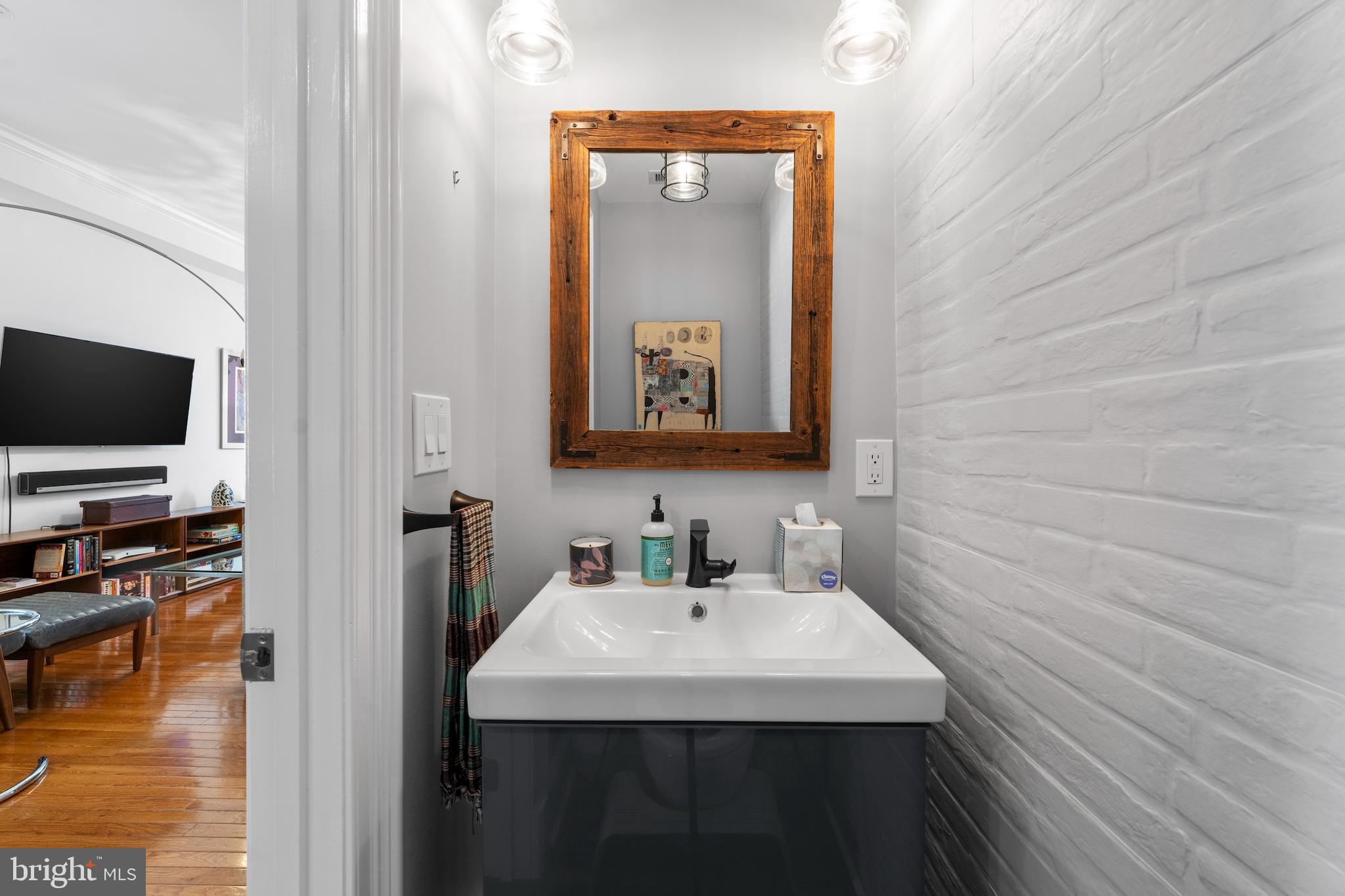 15 Seaton Place Northeast, Unit 2 Washington, DC 20002 - Photo 10 of 27 a bathroom with a sink and a mirror