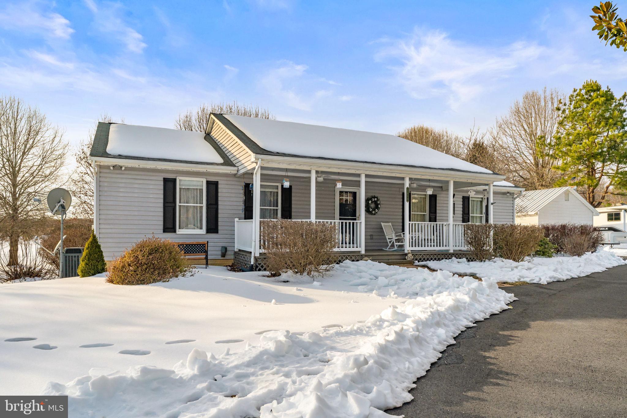Charming home nestled in a winter wonderland.