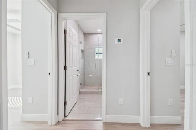 a view of a bathroom from a hallway