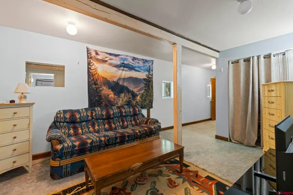 a bedroom with bed and a window