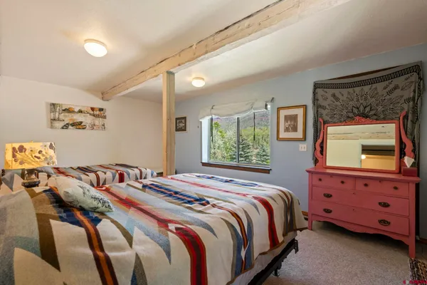 a bedroom with bed and a window