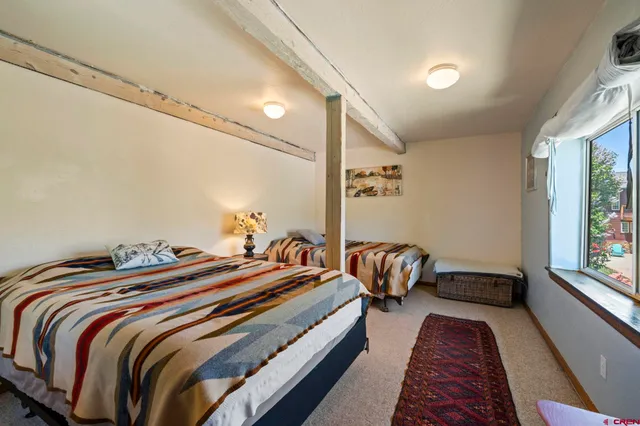 a view of an entryway with wooden floor and windows