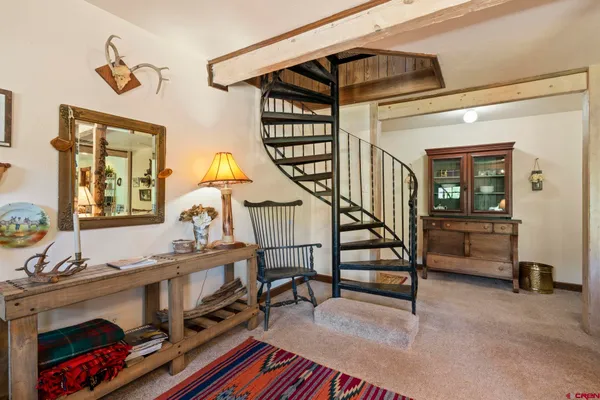 a view of entryway dining room and hall with wooden floor