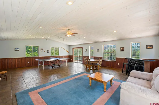 a view of a two chairs in the balcony