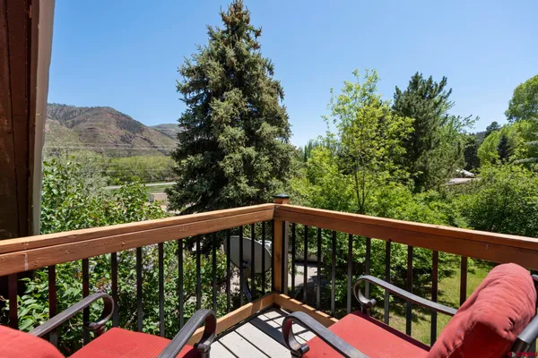 a pathway of a house with a yard