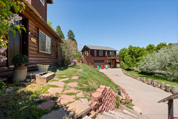 a balcony with wooden floor and outdoor space