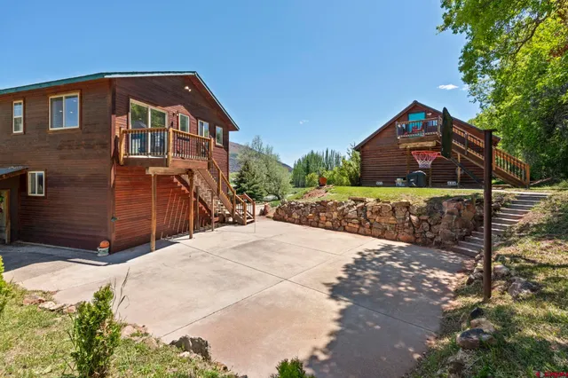 a front view of a house with a yard and a garage