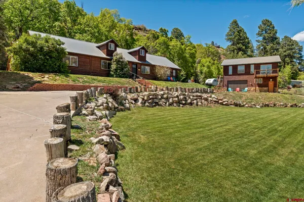 a view of a house with a big yard