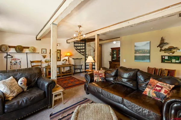 a living room with furniture and a couch