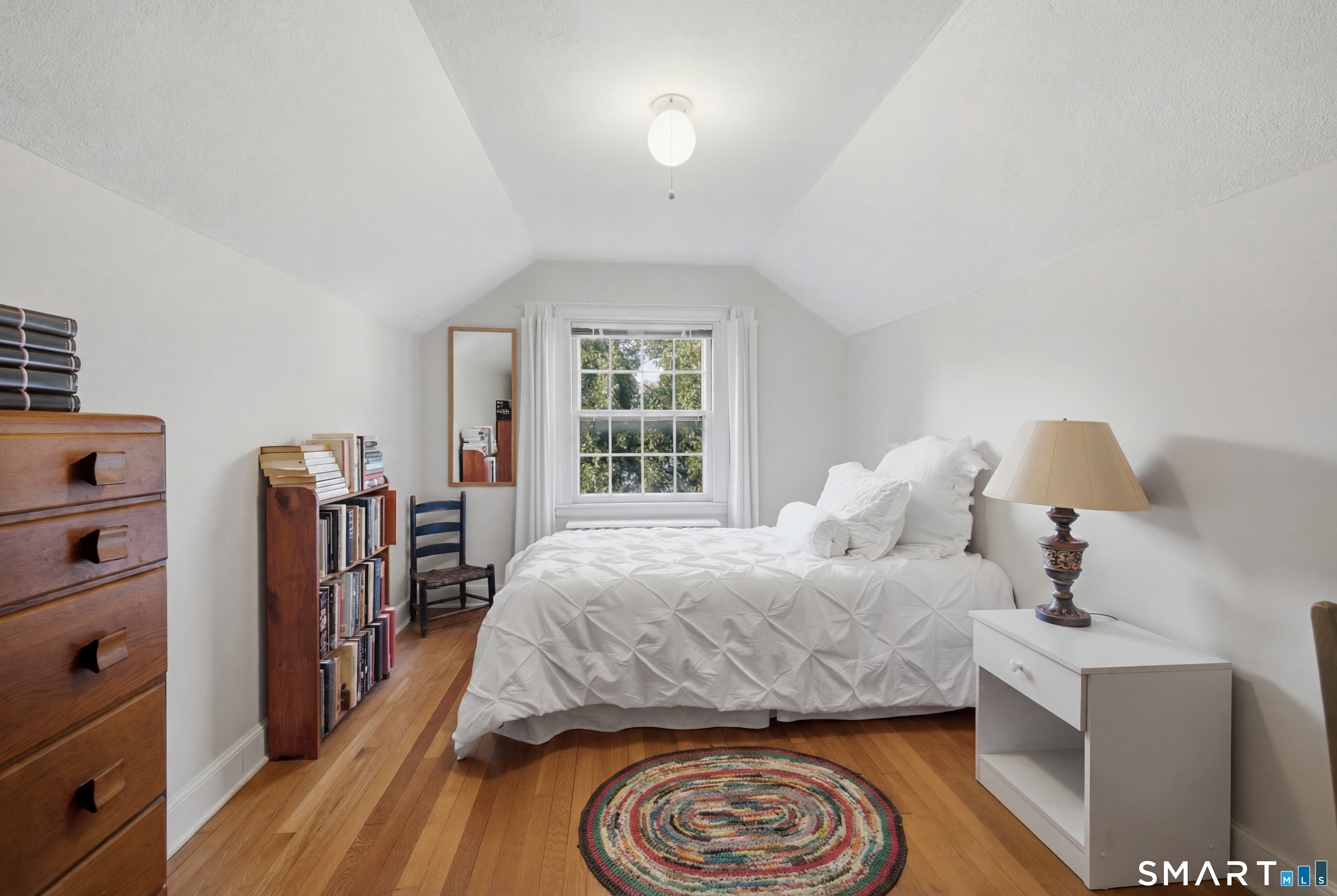 9 Stratford Road West Hartford, CT 06117 - Photo 31 of 40 A bright and airy bedroom with hardwood floors provides a peaceful retreat for family or guests