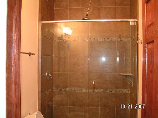 6909 Beckwith Road Morton Grove, IL 60053 - Photo 14 of 16 a bathroom with a shower