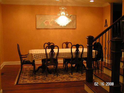 6909 Beckwith Road Morton Grove, IL 60053 - Photo 4 of 16 a view of a dining room with furniture and wooden floor