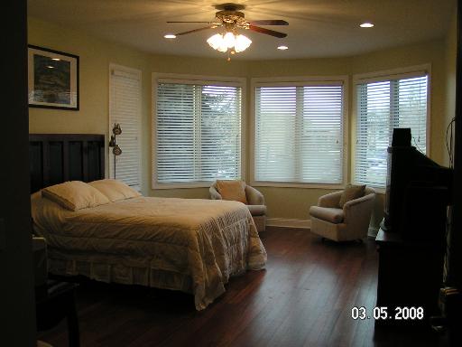 6909 Beckwith Road Morton Grove, IL 60053 - Photo 5 of 16 a bedroom with a bed and wooden floor