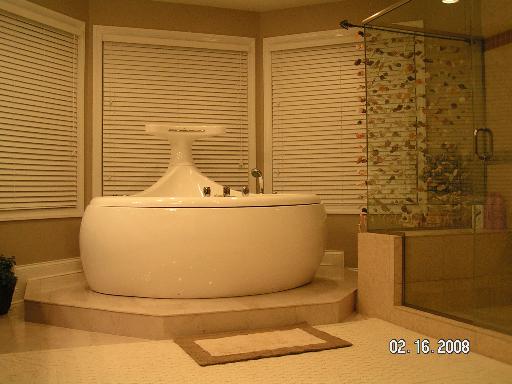 6909 Beckwith Road Morton Grove, IL 60053 - Photo 7 of 16 a white toilet sitting next to a shower