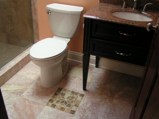 6909 Beckwith Road Morton Grove, IL 60053 - Photo 9 of 16 a bathroom with a granite countertop sink and a toilet