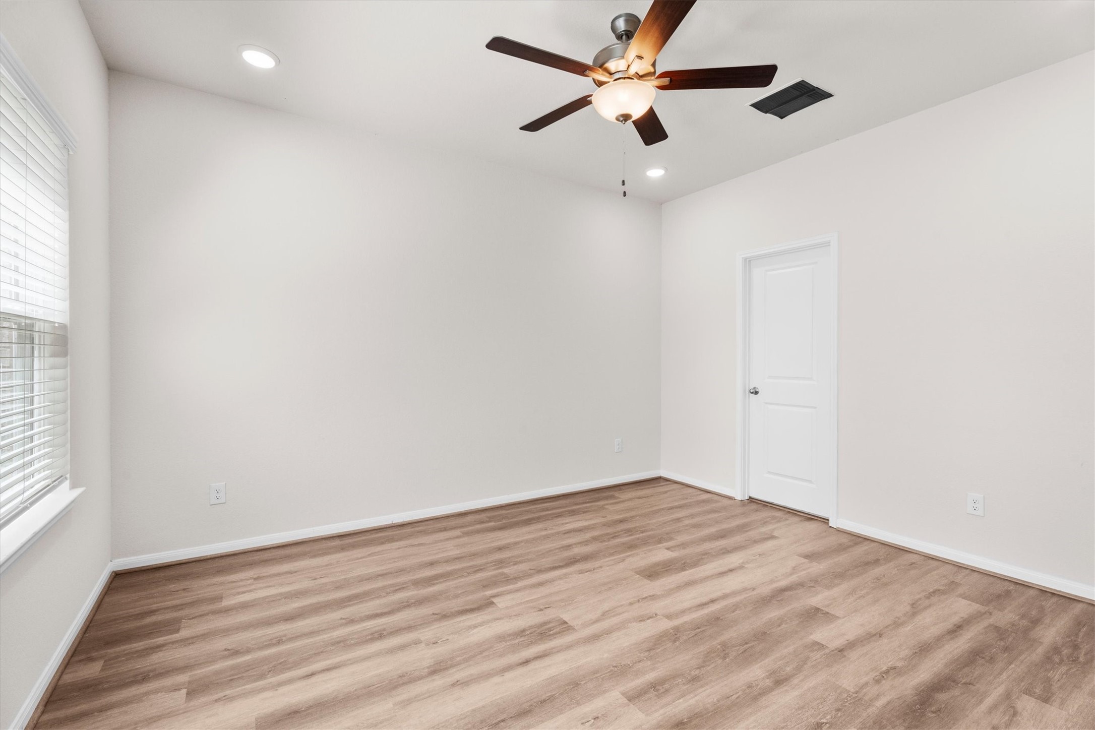 39 Courageous Side Way Magnolia, TX 77354 - Photo 12 of 44 Primary suite downstairs with walk-in closet and private bath.