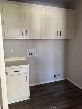 a view of cabinets and wooden floor