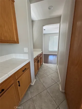 a kitchen with granite countertop a sink and a stove