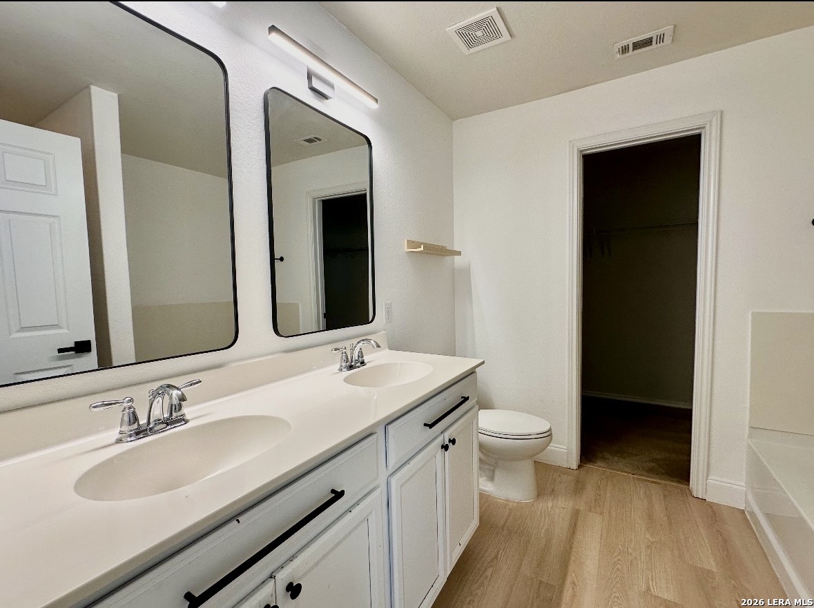443 Harvest Point Schertz, TX 78154 - Photo 12 of 13 a bathroom with a sink and a mirror