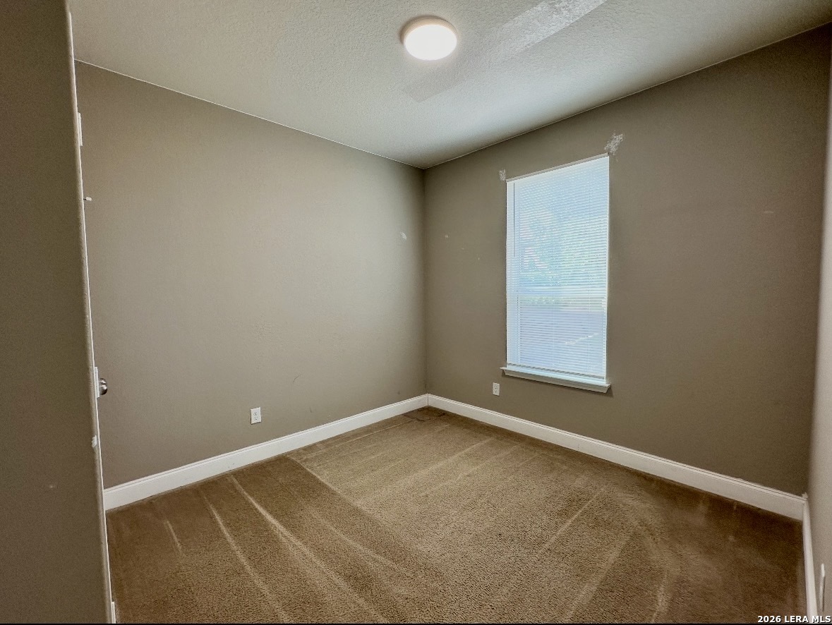 443 Harvest Point Schertz, TX 78154 - Photo 8 of 13 an empty room with a window