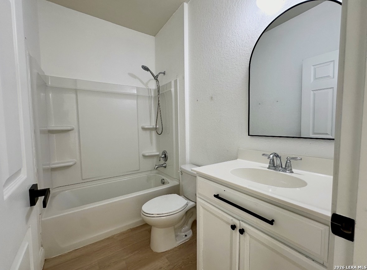 443 Harvest Point Schertz, TX 78154 - Photo 9 of 13 a bathroom with a sink a toilet and a mirror