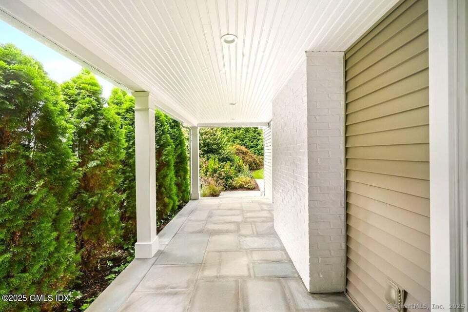 2 Sound View Terrace Greenwich, CT 06830 - Photo 11 of 39 a view of a garden from a window