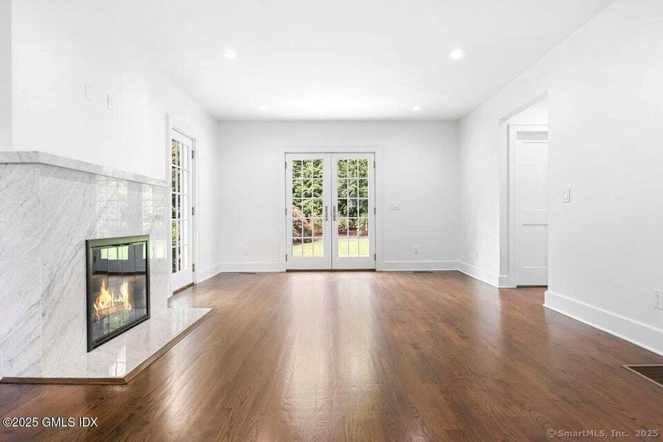 2 Sound View Terrace Greenwich, CT 06830 - Photo 14 of 39 a view of an empty room with a window and wooden floor