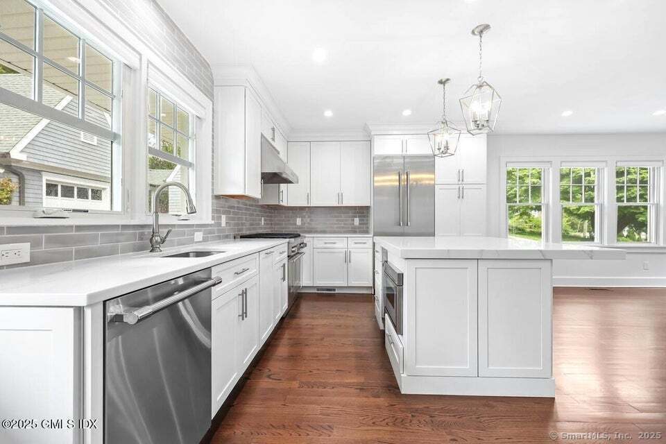 2 Sound View Terrace Greenwich, CT 06830 - Photo 2 of 39 a large kitchen with granite countertop a large window and white cabinets
