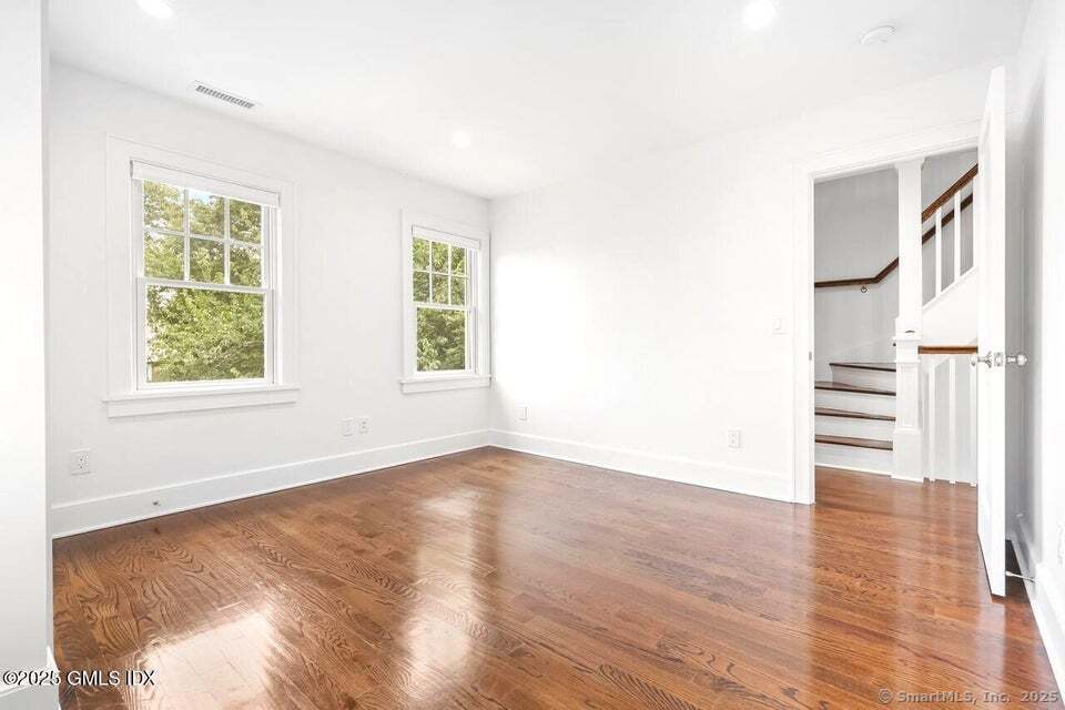 2 Sound View Terrace Greenwich, CT 06830 - Photo 21 of 39 a view of an empty room with wooden floor and a window