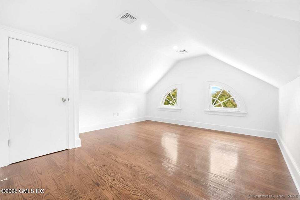 2 Sound View Terrace Greenwich, CT 06830 - Photo 26 of 39 a view of an empty room with wooden floor and a window