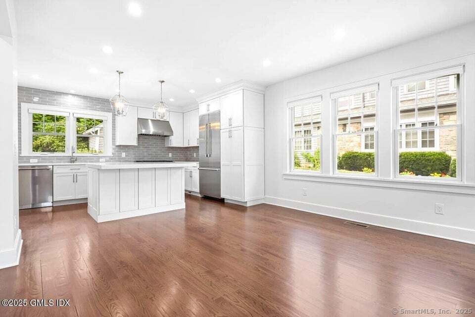 2 Sound View Terrace Greenwich, CT 06830 - Photo 3 of 39 a view of an empty room with kitchen and a window