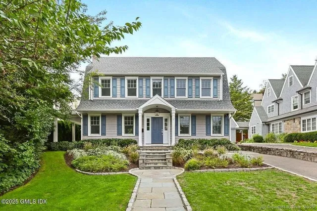 front view of a house with a yard