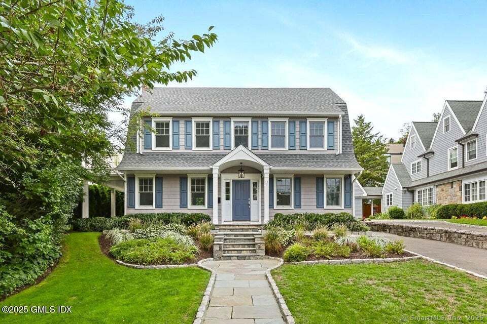 2 Sound View Terrace Greenwich, CT 06830 - Photo 39 of 39 front view of a house with a yard