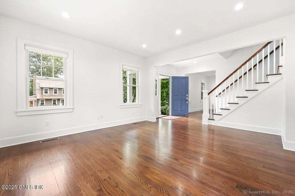 2 Sound View Terrace Greenwich, CT 06830 - Photo 7 of 39 a view of an empty room with wooden floor and a window