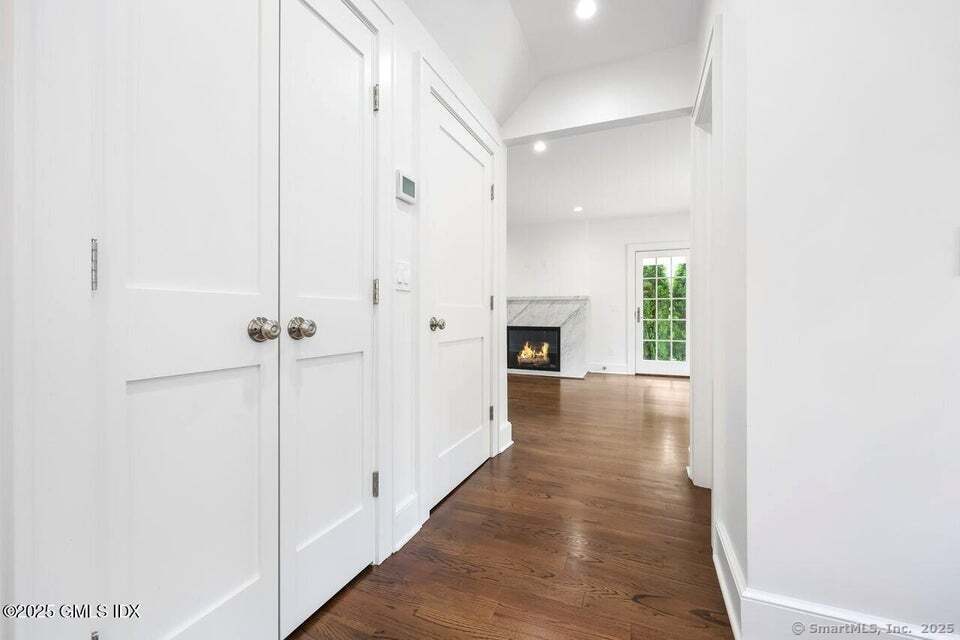 2 Sound View Terrace Greenwich, CT 06830 - Photo 8 of 39 a view of a hallway with white walls and a window