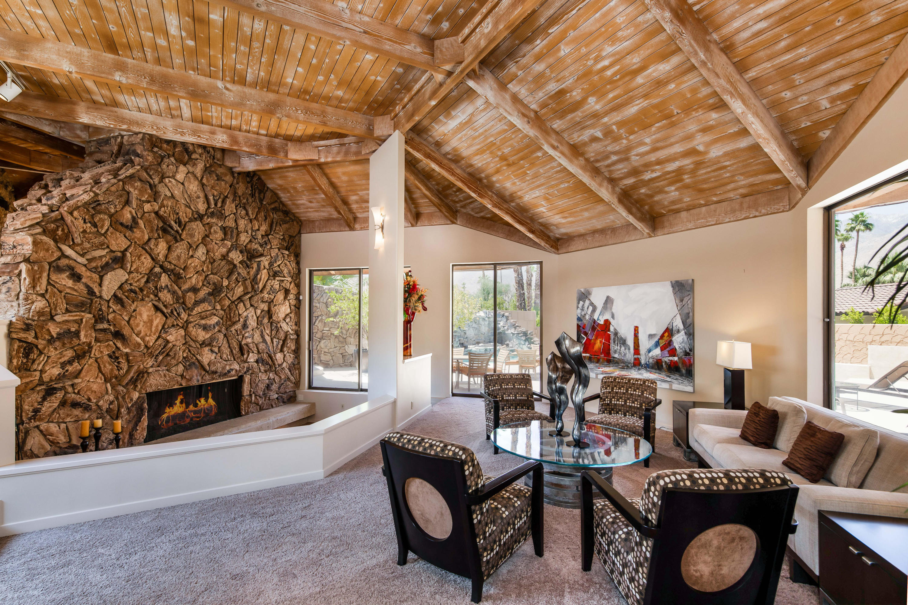 1650 Ridgemore Drive Palm Springs, CA 92264 - Photo 14 of 69 a living room with furniture and a fireplace