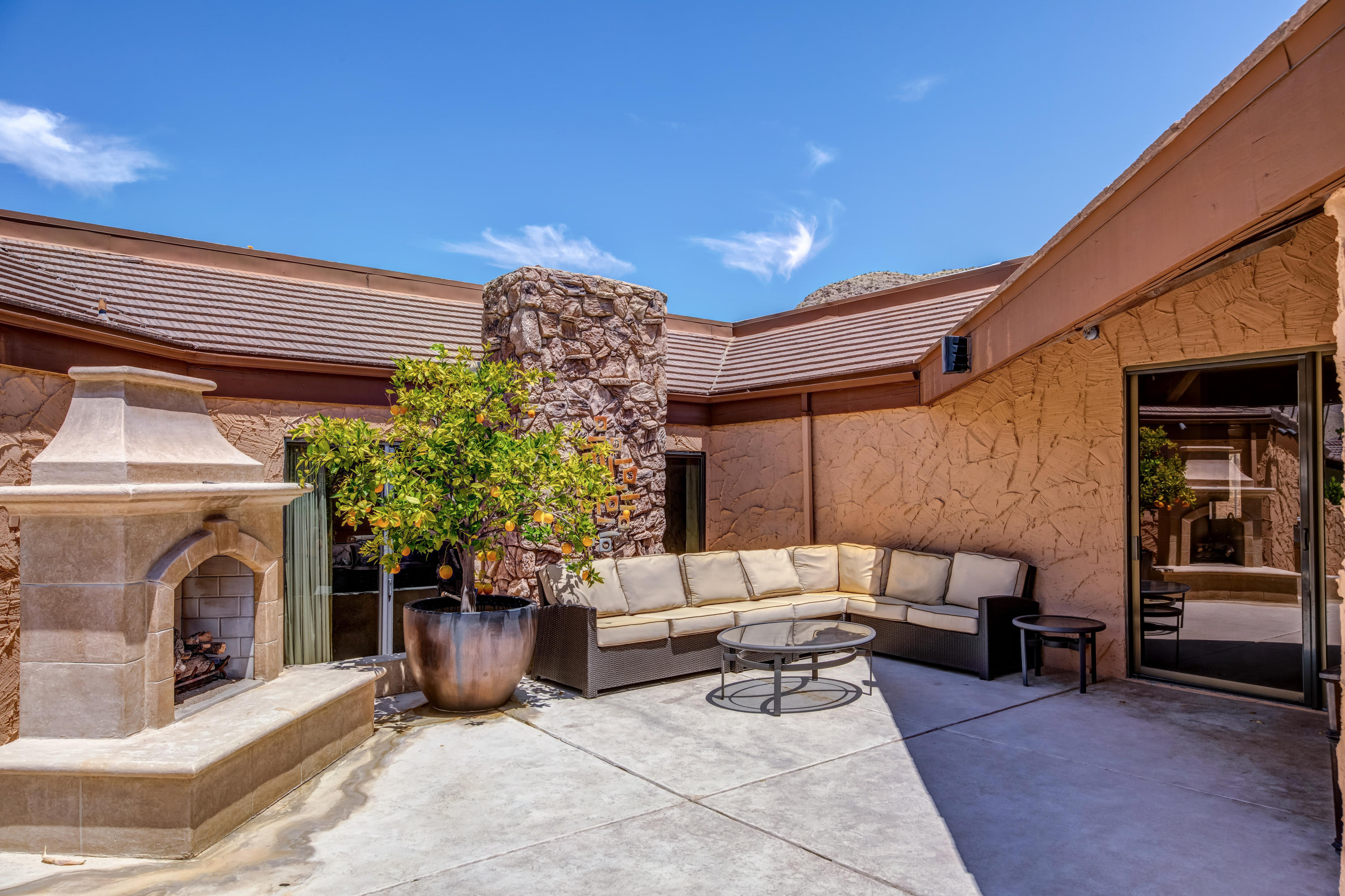 1650 Ridgemore Drive Palm Springs, CA 92264 - Photo 20 of 69 a view of a patio with couches and potted plants