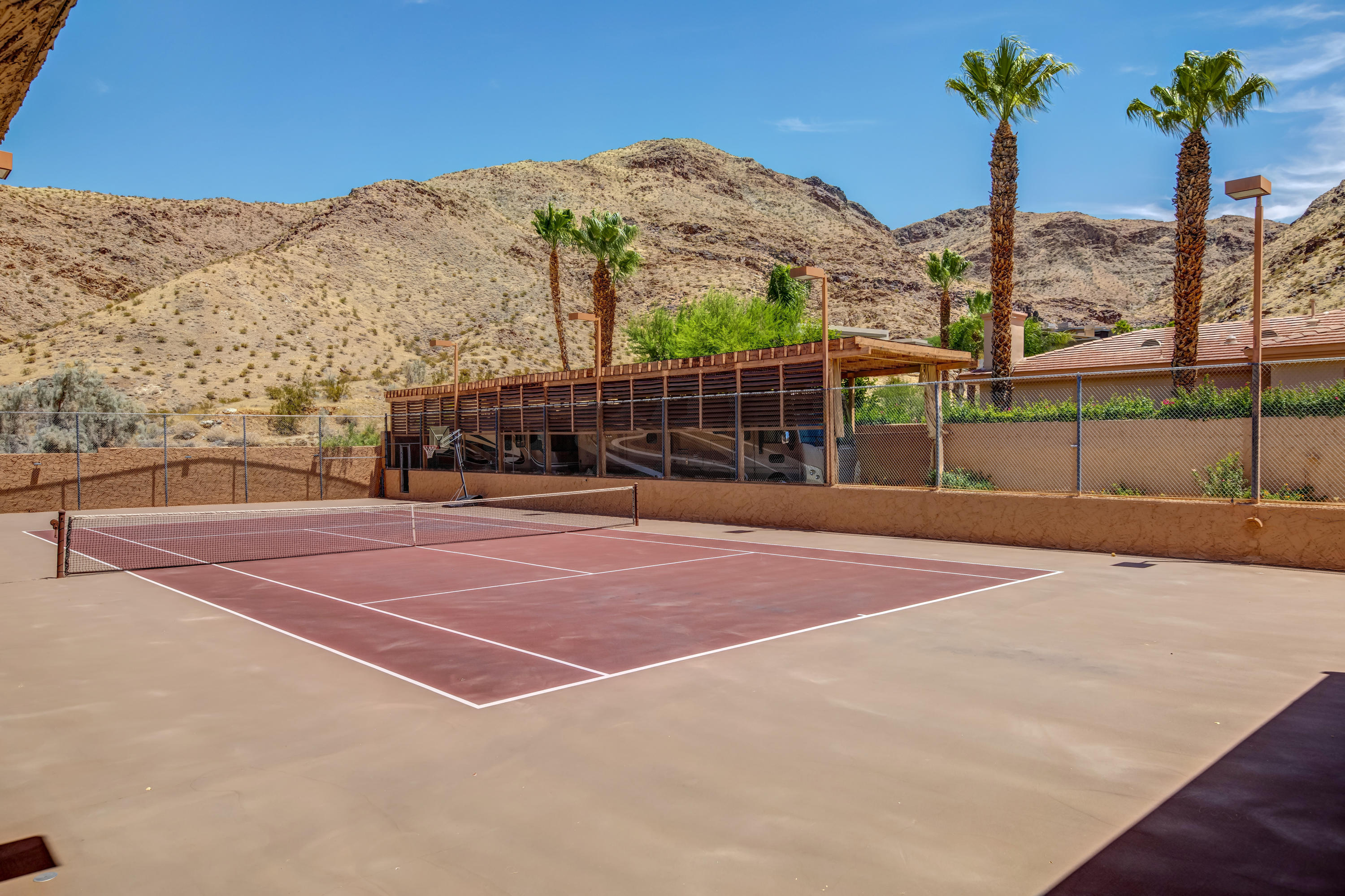 1650 Ridgemore Drive Palm Springs, CA 92264 - Photo 3 of 69 a view of a tennis court with a basket ball court