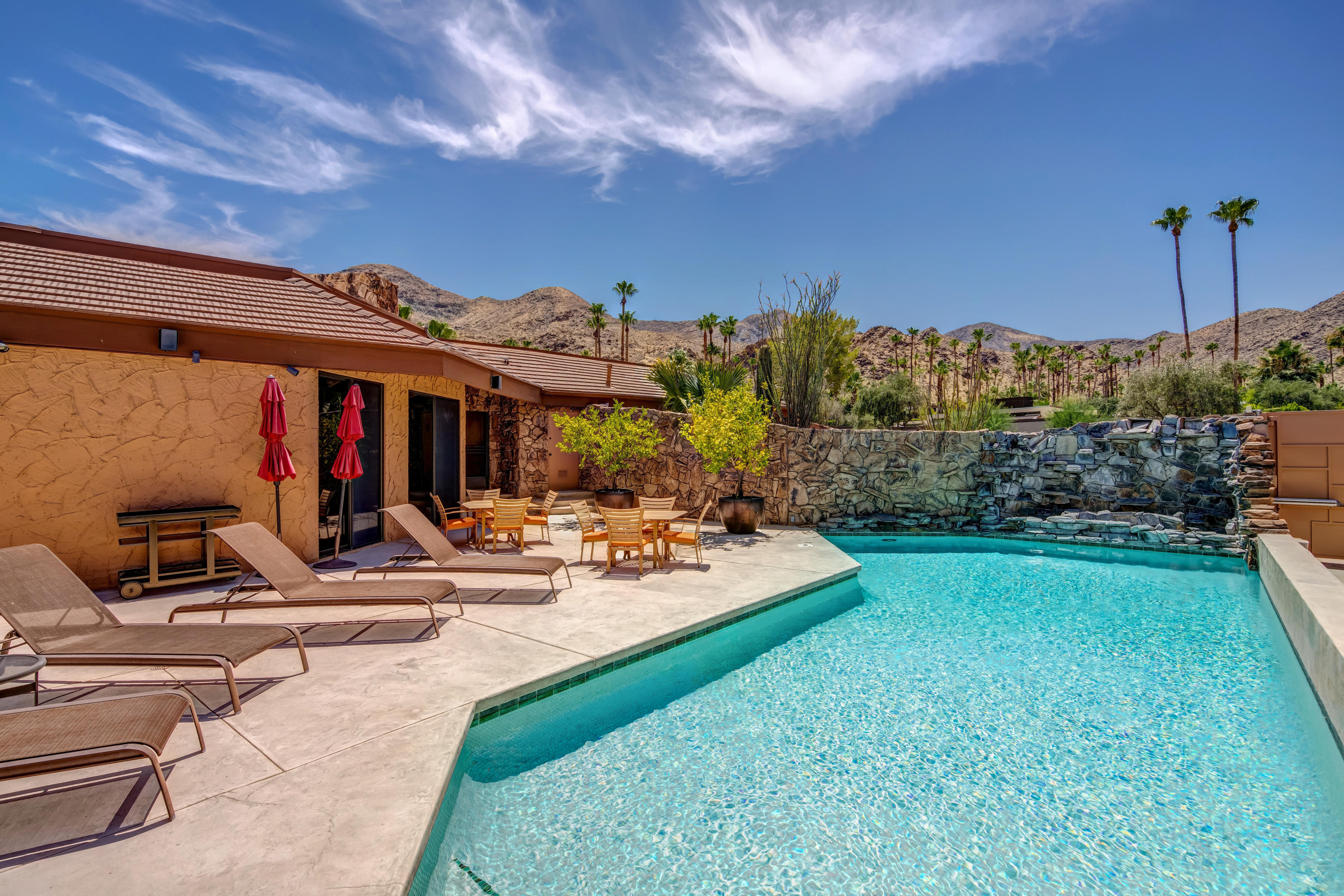 1650 Ridgemore Drive Palm Springs, CA 92264 - Photo 21 of 69 a view of a backyard with plants and a patio