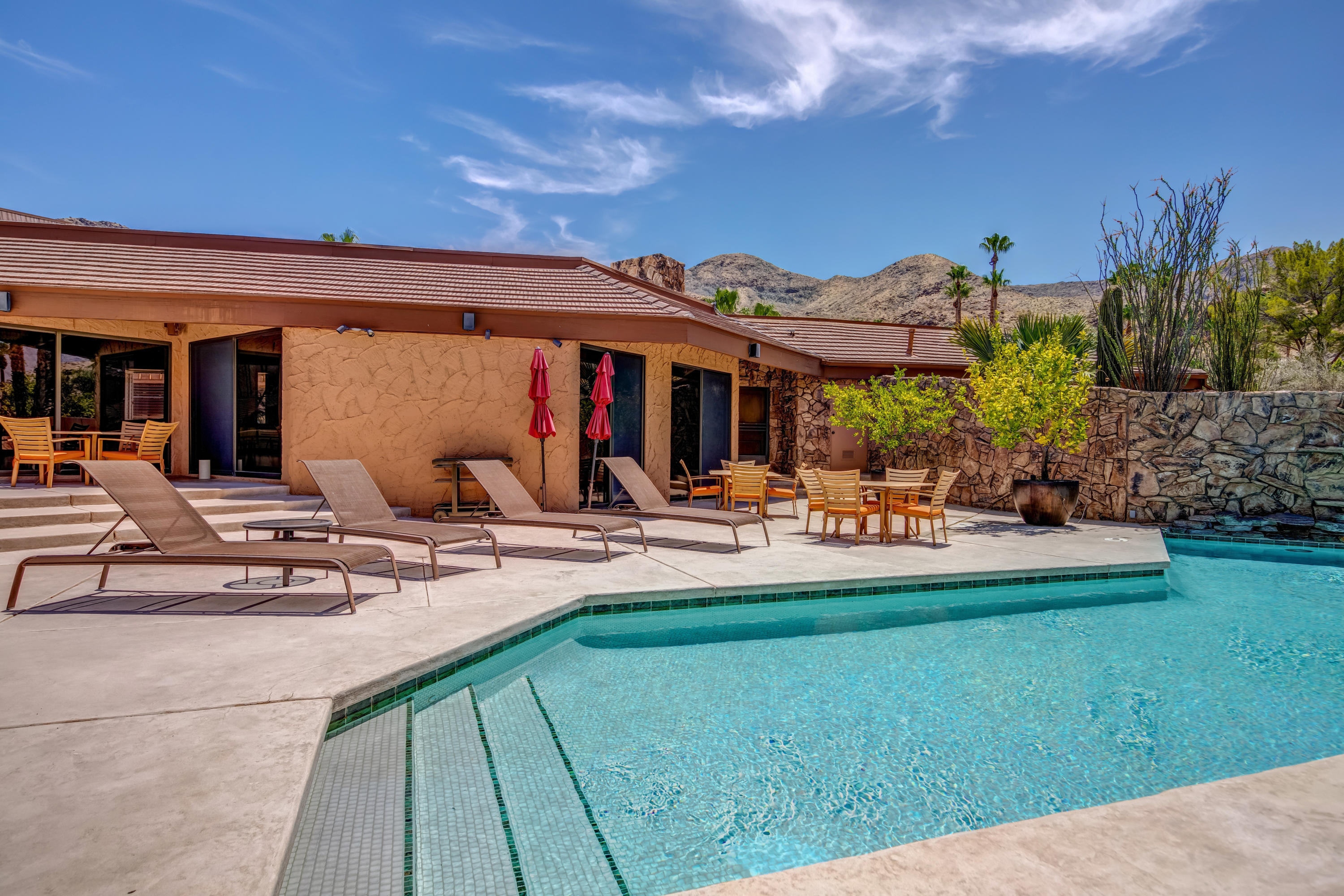 1650 Ridgemore Drive Palm Springs, CA 92264 - Photo 22 of 69 a view of a backyard with plants and a patio