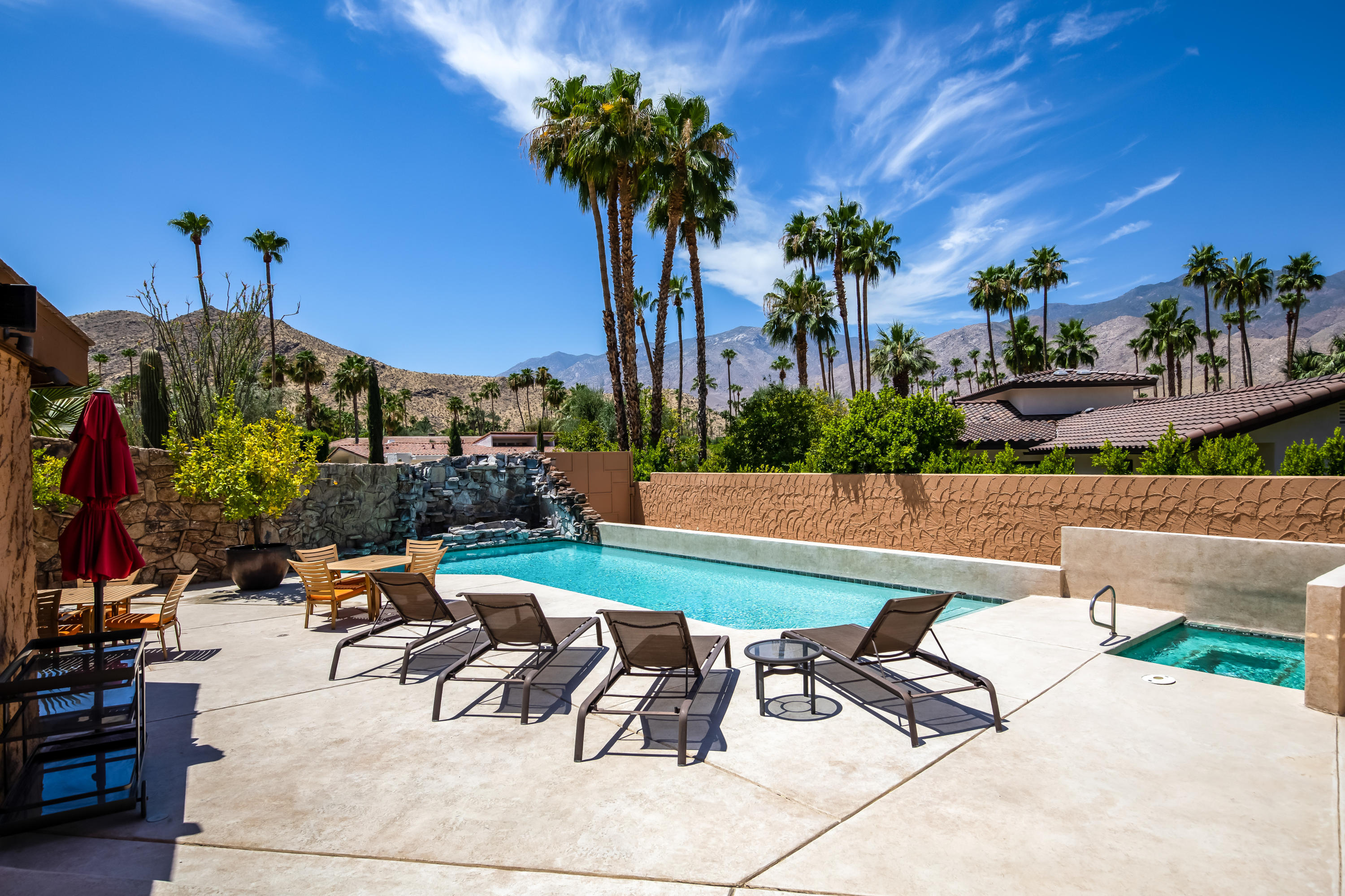 1650 Ridgemore Drive Palm Springs, CA 92264 - Photo 25 of 69 a view of a patio with a table and chairs