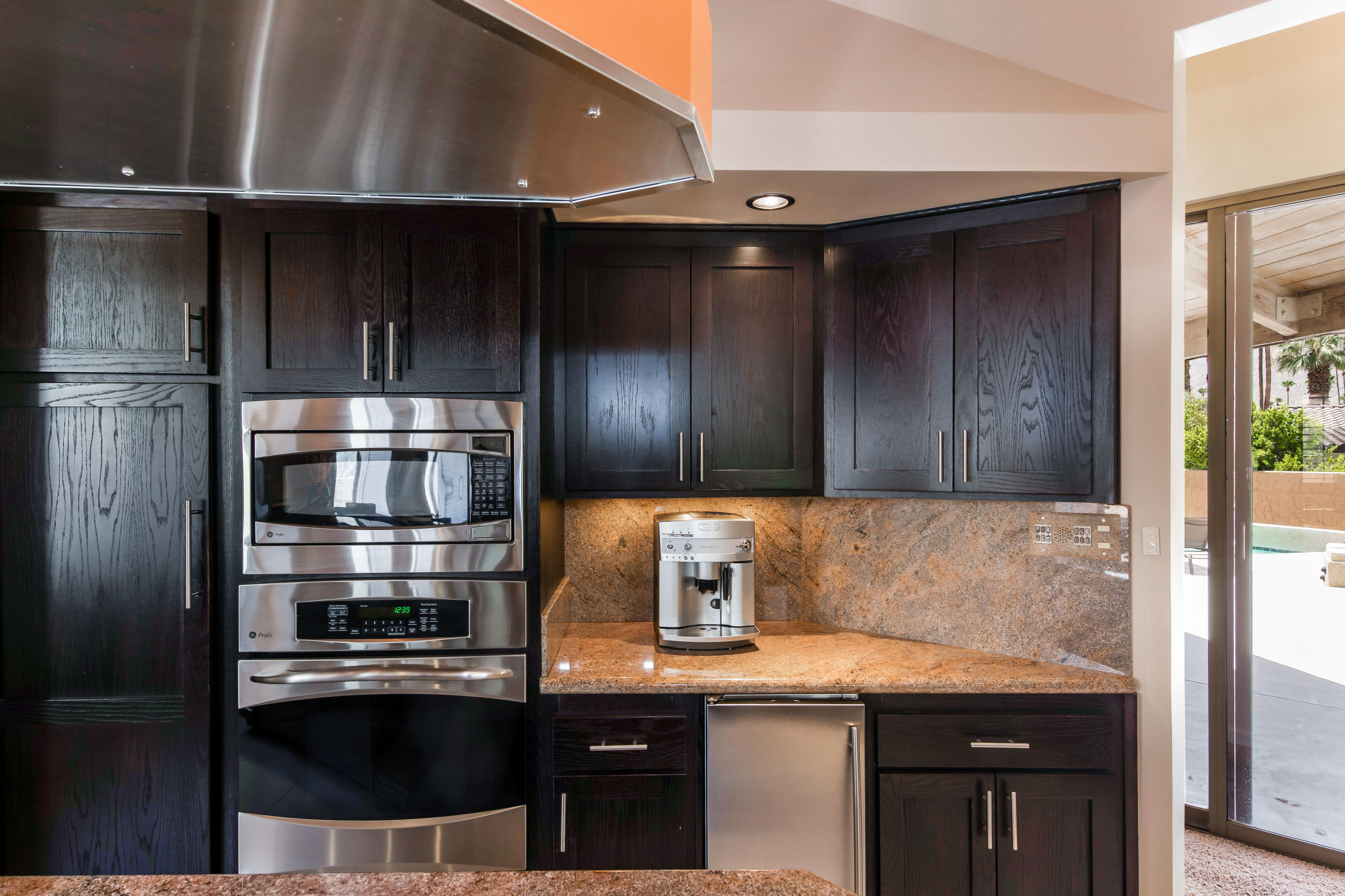 1650 Ridgemore Drive Palm Springs, CA 92264 - Photo 27 of 69 a kitchen with a sink and cabinets