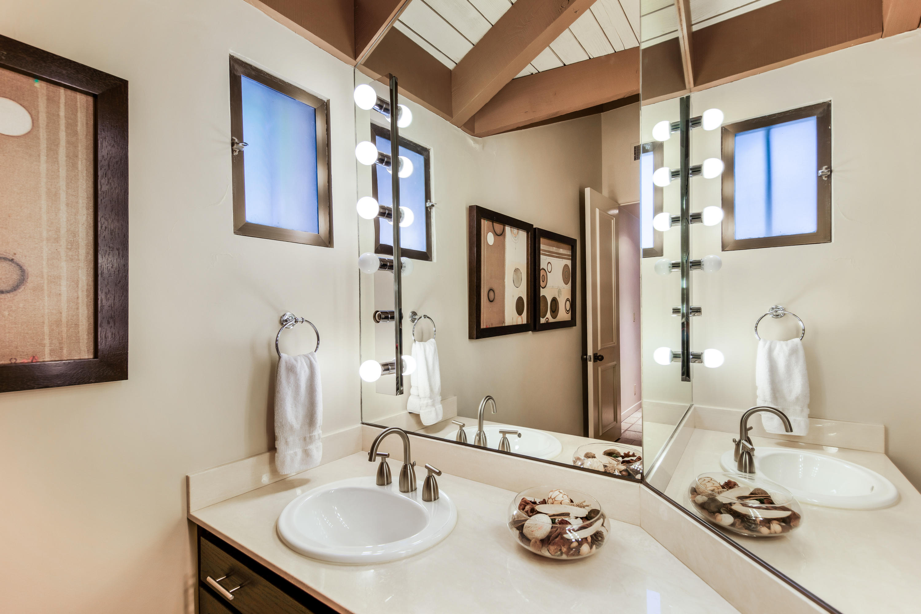 1650 Ridgemore Drive Palm Springs, CA 92264 - Photo 35 of 69 a bathroom with a sink and a mirror