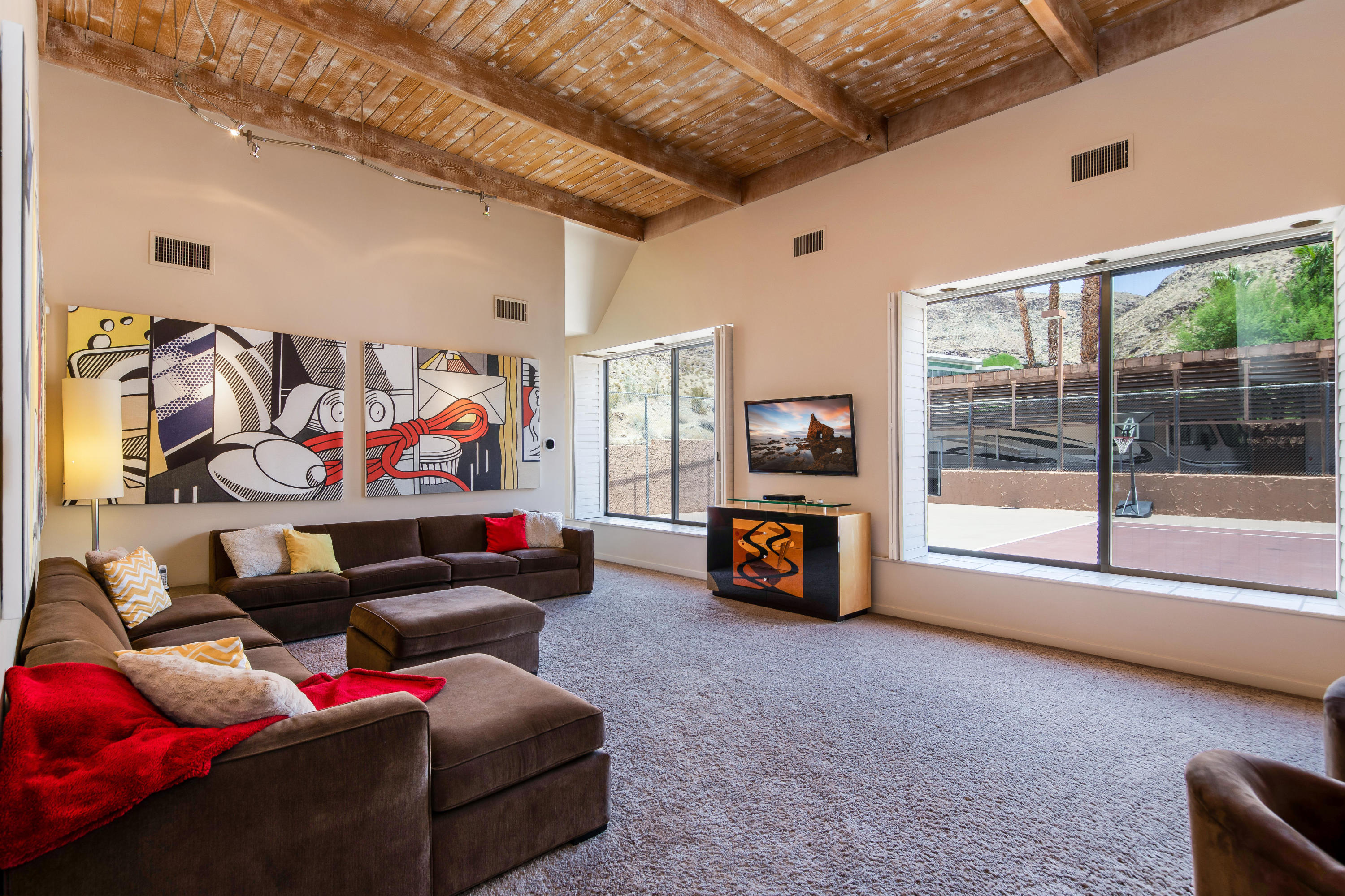 1650 Ridgemore Drive Palm Springs, CA 92264 - Photo 36 of 69 a living room with furniture and a flat screen tv
